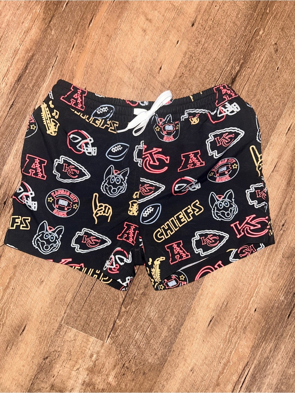 chubbies Kids Black Chiefs Logo Swim Trunks with Red & Yellow Prints